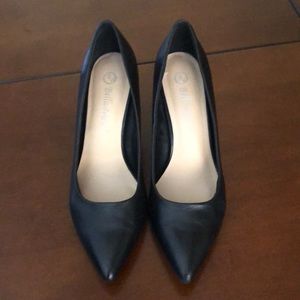 Black leather pumps